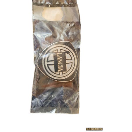 Stemma originale Lancia con logo "LANCIA" - Originale NOS - cod. 0007747395